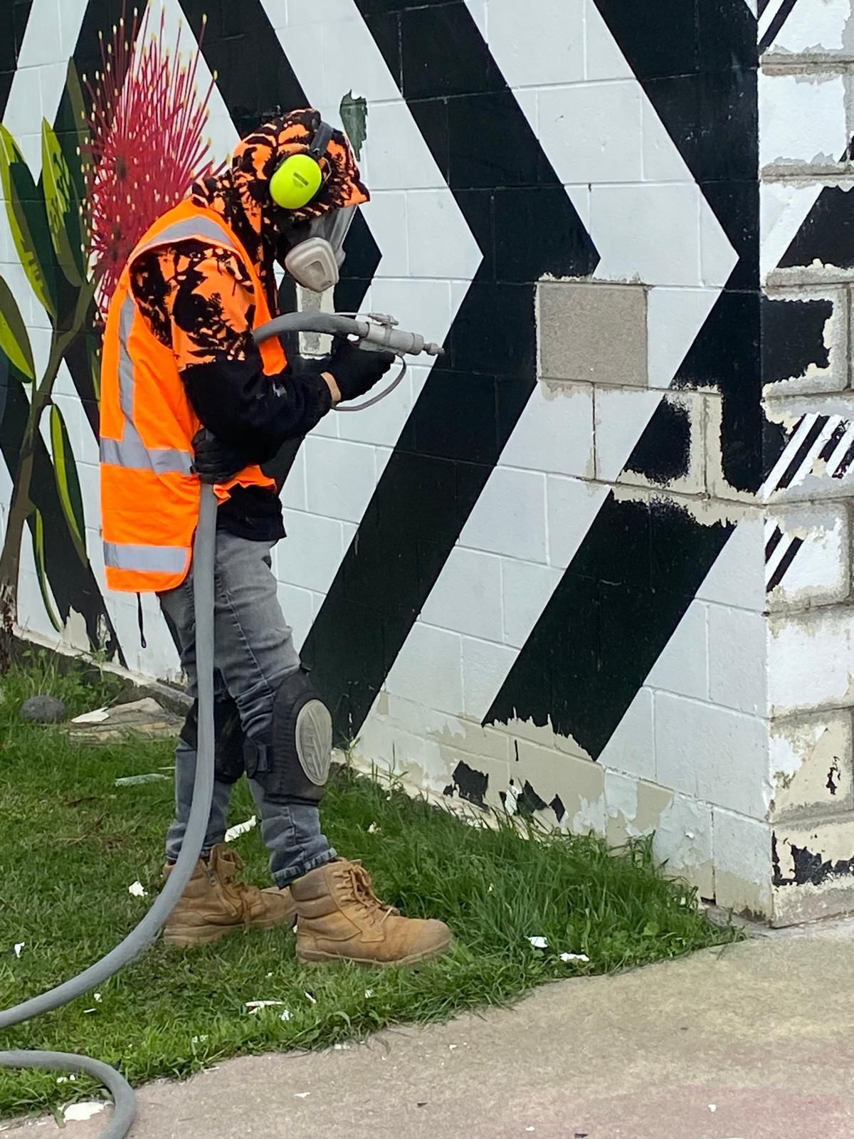BlastOff operator blasting the toilet block wall at Eric Armishaw Park