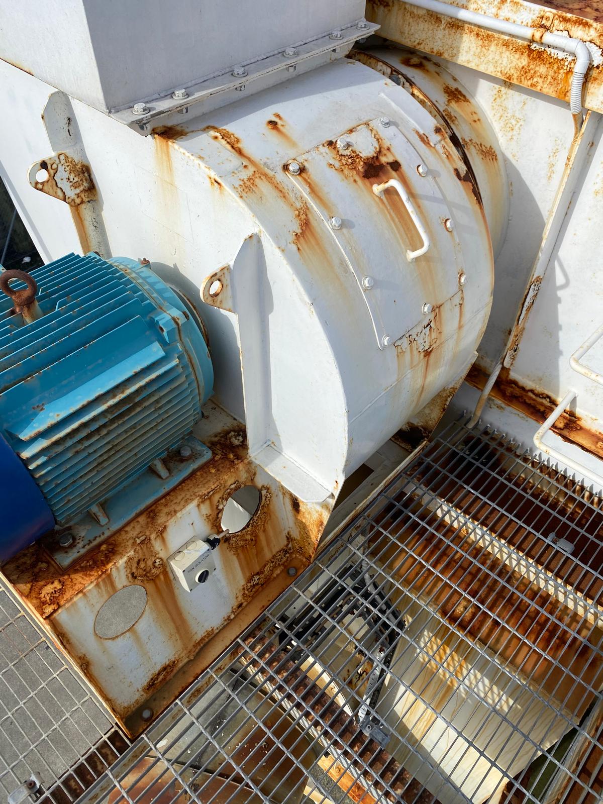 Corroded dust collector fan housing before restoration