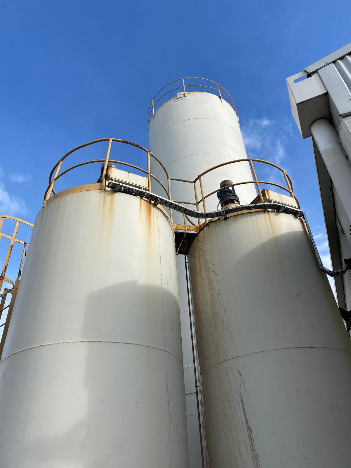 Corroded industrial tanks before surface preparation